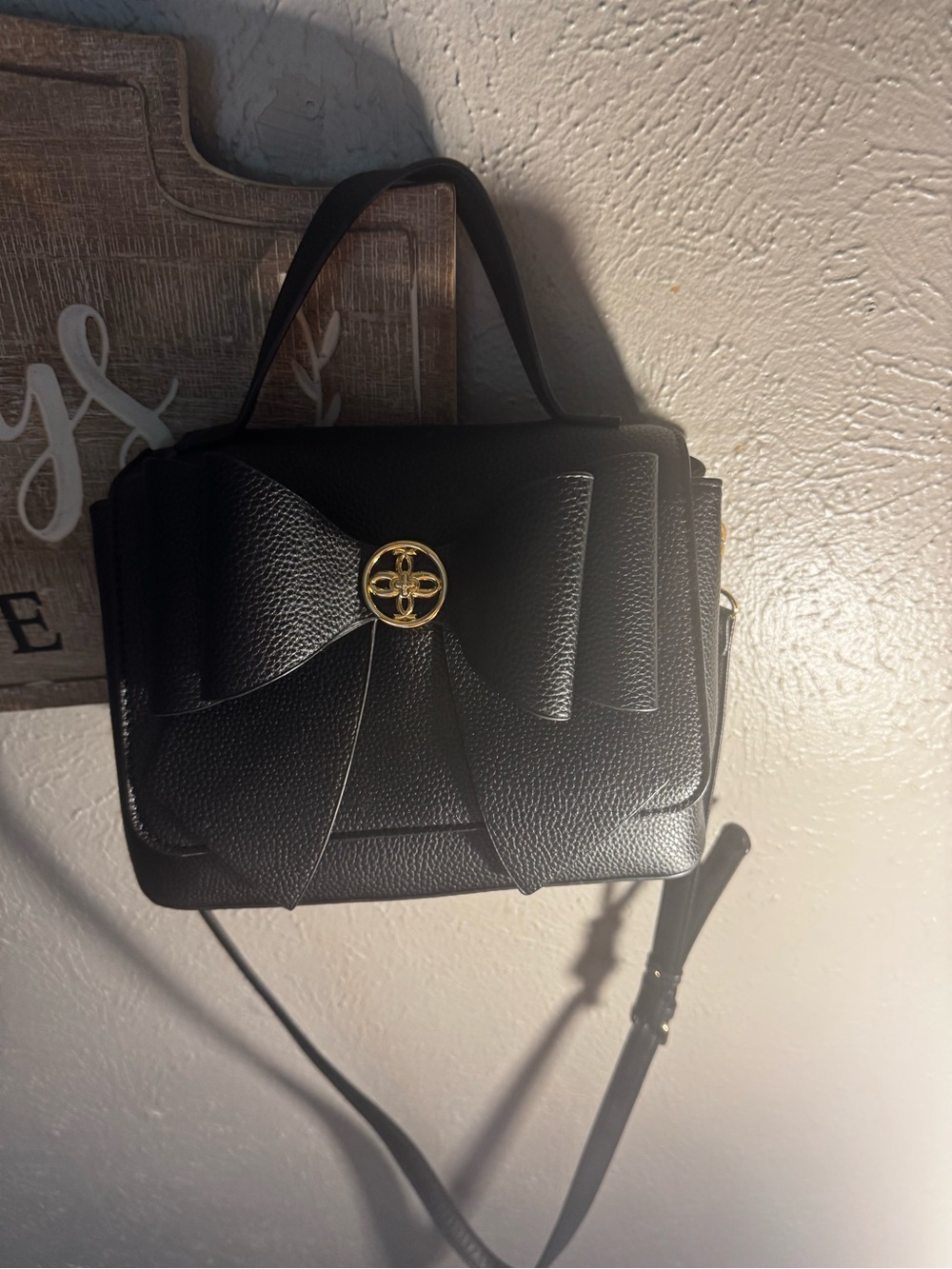 Classic Black Bow-Front Crossbody Bag with Gold Accent